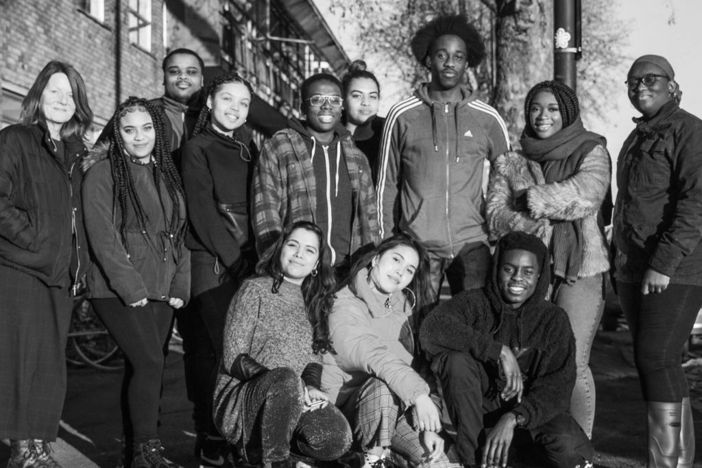 Black and white photograph of Rising Arts Agency's group of young creatives