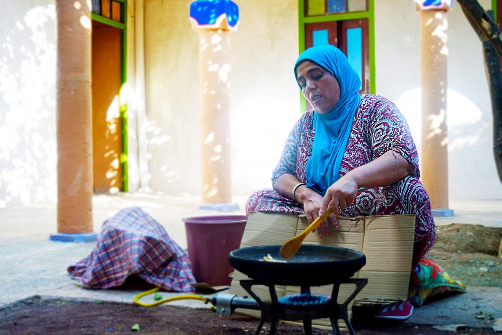 EBM - woman roasting argan kernel